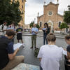 Students listening to an instructor on a study away in Italy.